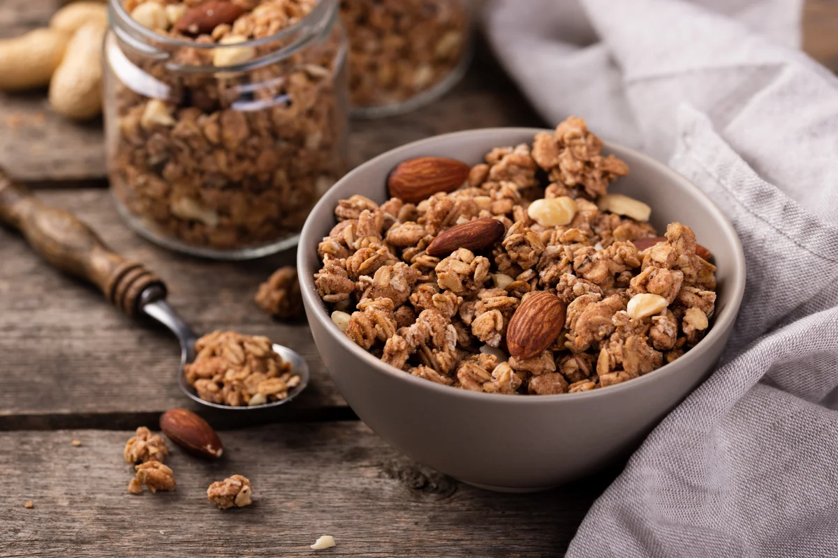 Delicious homemade low sugar granola recipe on a baking sheet.