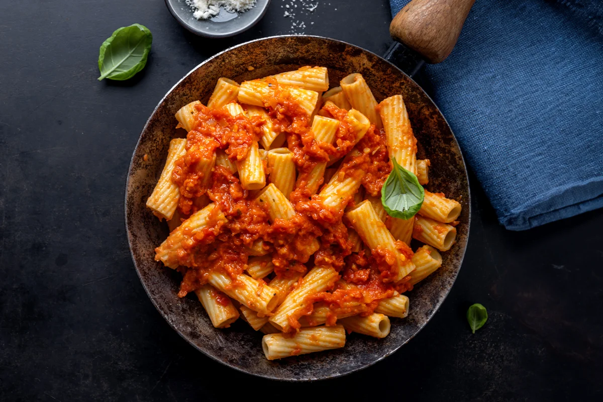 Delicious carbone spicy rigatoni recipe served on a plate, ready to eat.